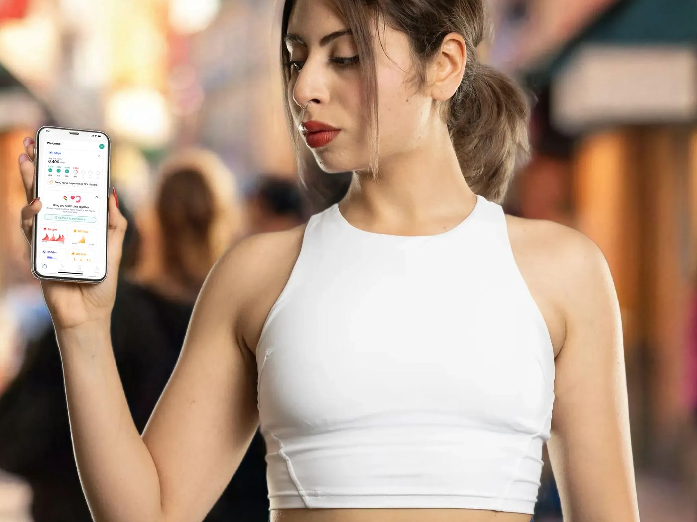 A person outdoors checking their walking summary in the eSteps app